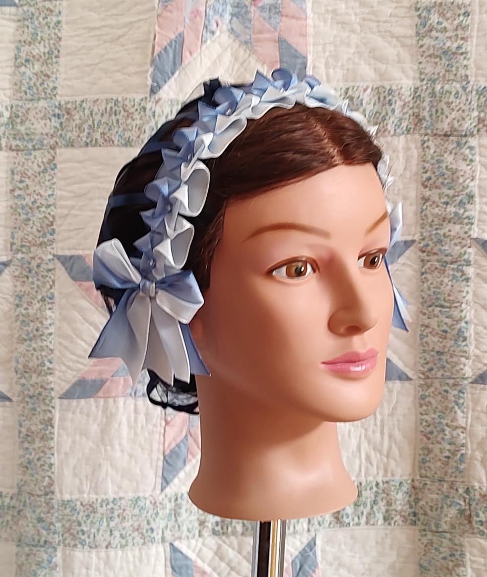 blue variegated ribbon coronet on a navy ribbon hairnet