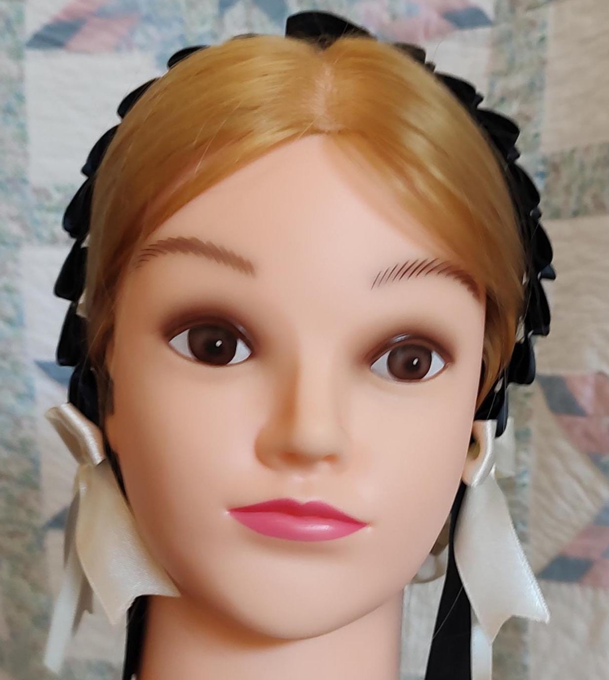 front view of black ribbon hairnet