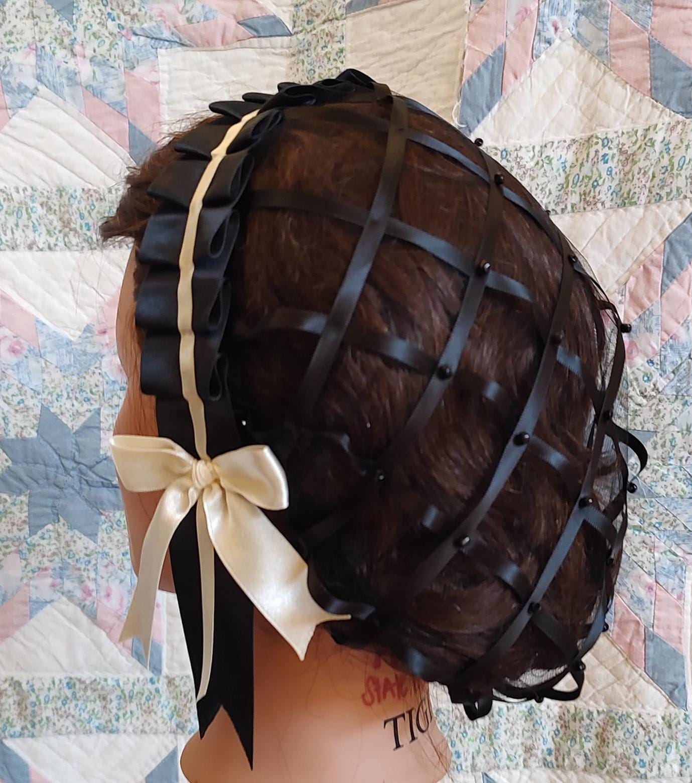 back view of black ribbon hairnet showing black tulle