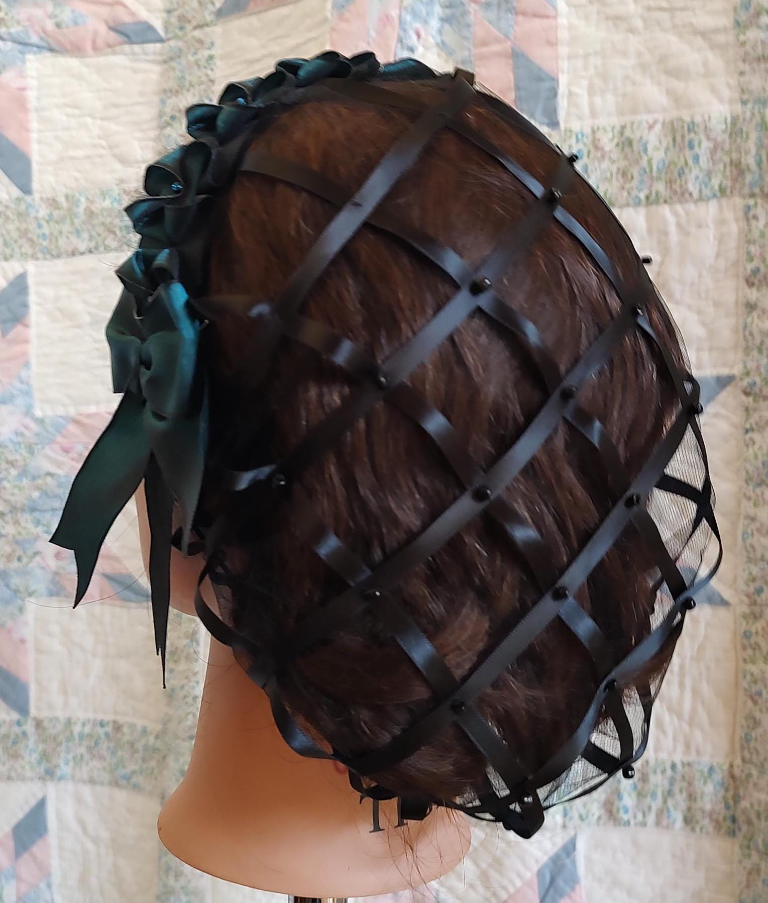 back view of black ribbon hairnet showing ribbon and beads